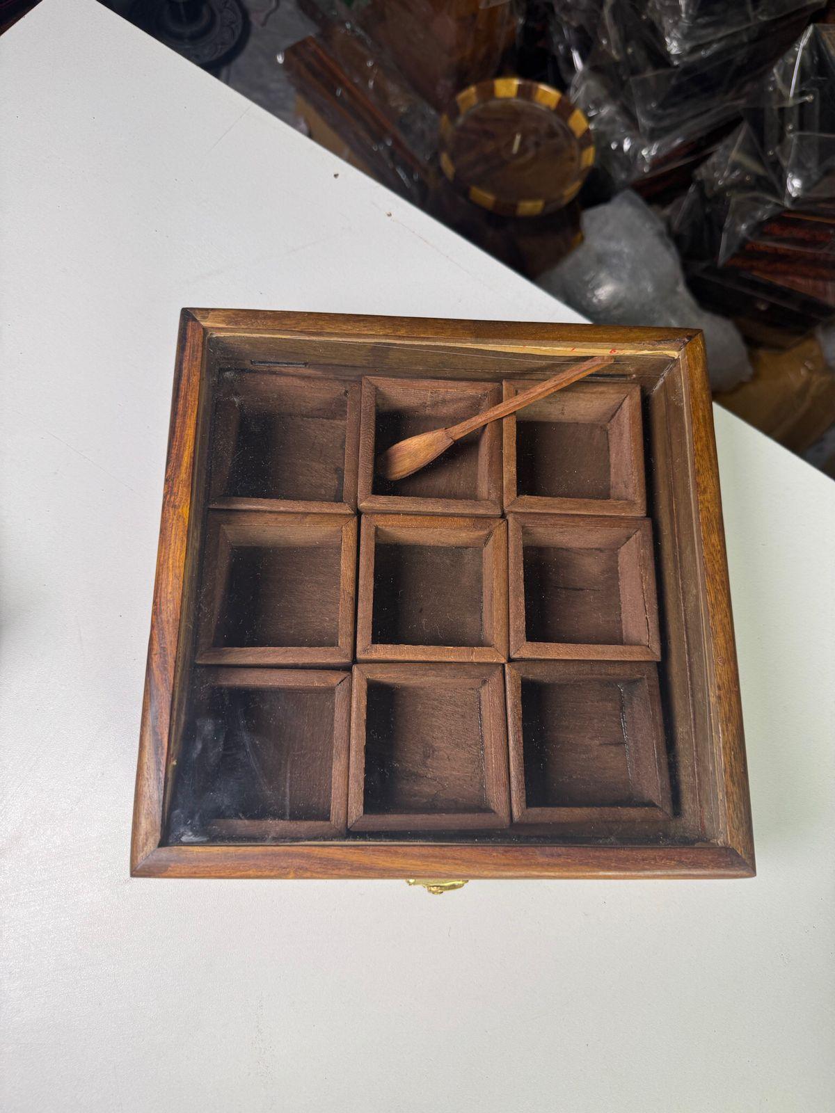 Carved wooden spice box with multiple compartments
